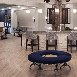 A modern lounge area with stylish seating and ambient lighting.