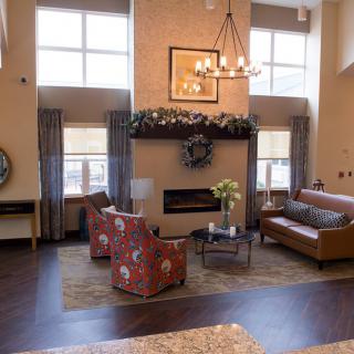 A cozy living room with elegant furniture and a fireplace.