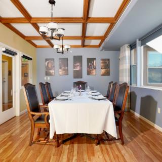 Elegant dining room with a set table and classic decor.