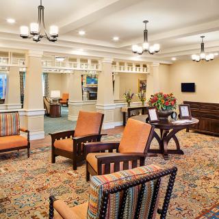 A well-furnished lobby area with comfortable seating and elegant lighting.