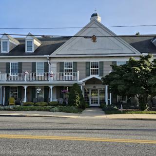 A charming architectural building featuring a combination of residential and commercial elements.