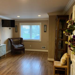 Cozy living room with wooden flooring and elegant decor.