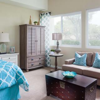 A bright and modern bedroom with stylish furnishings and ample natural light.