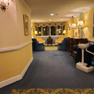 A cozy hotel lobby featuring comfortable seating and warm lighting.