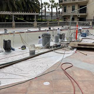 Construction site for pool renovation with various tools and materials.
