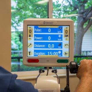 A rehabilitation monitor displaying vital statistics during a patient's exercise session.