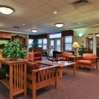 A cozy lobby with comfortable seating and warm lighting.