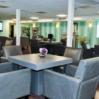 A modern lounge area with comfortable seating and a decorative table centerpiece.