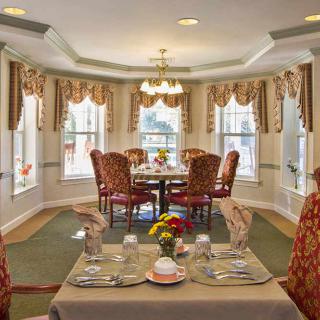 Elegant dining room with a beautifully set table and classic decor.