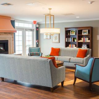 A cozy living room with modern furnishings and warm lighting.