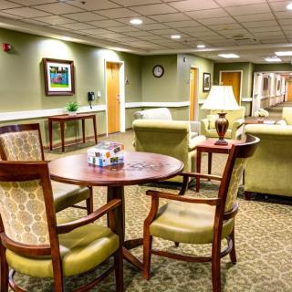 A cozy lobby with comfortable seating and warm lighting.
