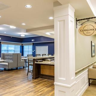 A modern dining area with elegant furnishings and warm lighting.