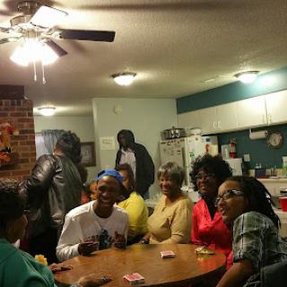 A joyful family gathering during game night, filled with laughter and friendly competition.