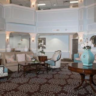 A luxurious hotel lobby with elegant furniture and vintage decor.