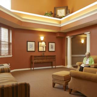 A cozy lounge area featuring warm tones and comfortable seating, perfect for relaxation.