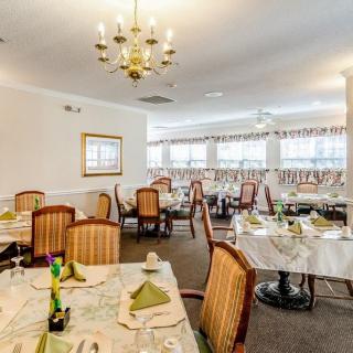 Elegant dining area with neatly arranged tables and classic decor.