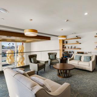 A modern living room with comfortable seating and stylish decor.