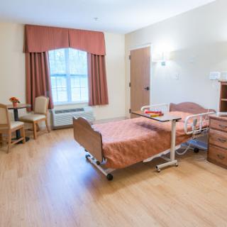 A well-lit hospital room designed for patient comfort and care.