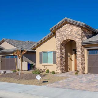 Modern suburban house with a stone facade and two garages.