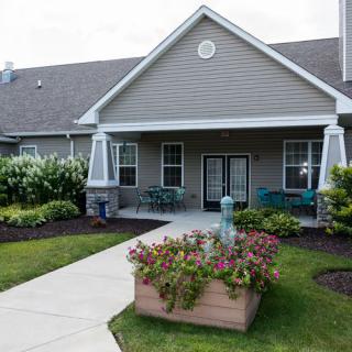 A cozy house with a well-maintained garden and inviting entrance.