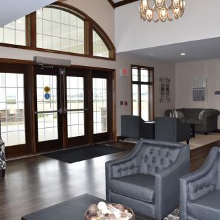 A modern lobby area with stylish seating and large windows.