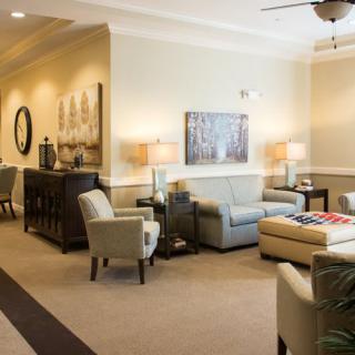 A modern and cozy living room with comfortable seating, elegant lighting, and stylish decor.