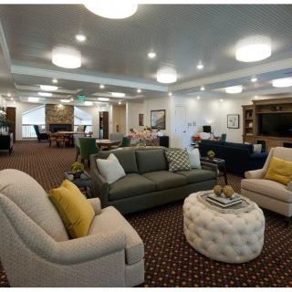 A luxurious living room with comfortable seating and elegant decor.