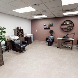 A cozy salon interior with comfortable chairs and modern decor.