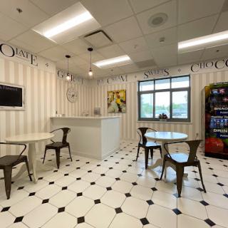 A cozy cafe-style breakroom with elegant decor and modern seating.