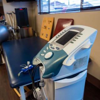 A therapy room with medical equipment used for rehabilitation.