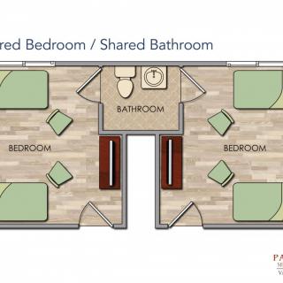 A floor plan depicting two shared bedrooms with a central shared bathroom.