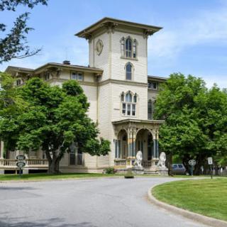 A beautiful historic building surrounded by greenery.