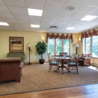 A cozy living room with comfortable seating and large windows.
