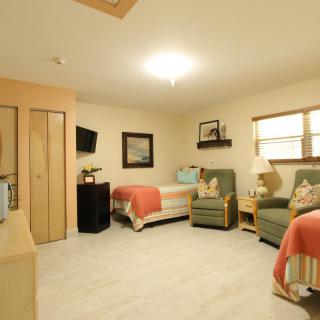 Cozy living room with comfortable seating and warm decor.