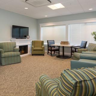 A cozy living room with comfortable seating and a television.