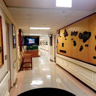 A museum hallway lined with exhibits and artifacts.