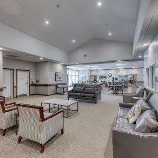 A spacious and elegantly designed lobby area with modern furniture and ample lighting.