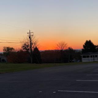 A tranquil sunset casting warm colors across the evening sky.