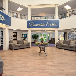 A welcoming lobby with comfortable seating and a central table.