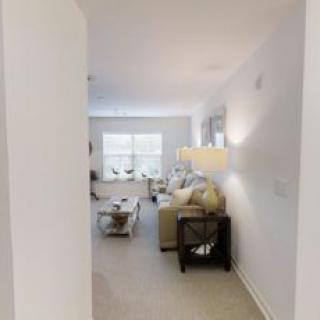 A modern living room with comfortable seating and stylish decor.