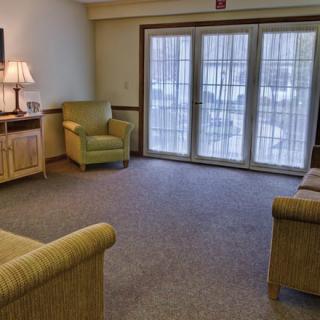 A cozy living room with comfortable seating and natural light.