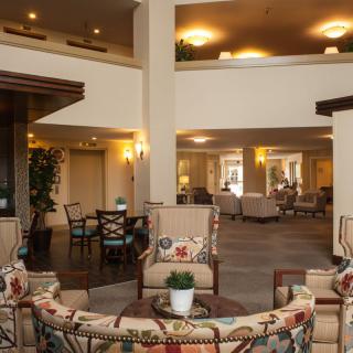 A modern hotel lobby with comfortable seating and elegant decor.