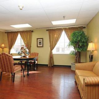 A cozy living room with elegant furniture and decor.