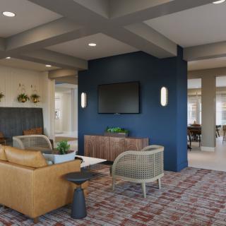 A modern living room with a blue accent wall, featuring comfortable seating and a mounted television.