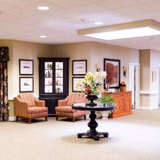 A well-furnished lobby with comfortable seating and elegant decor.
