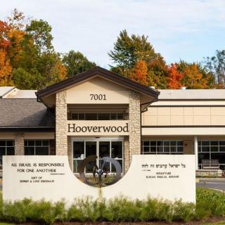 The entrance of Hooverwood, surrounded by autumn foliage.