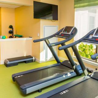An indoor gym with treadmills and other exercise equipment.