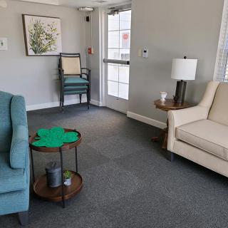 A cozy living room with comfortable seating and simple decor.