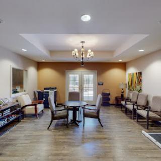 A cozy waiting area featuring comfortable chairs and a welcoming atmosphere.