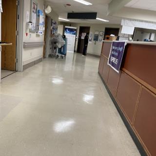 A view of a hospital hallway, showcasing the clean and well-lit environment.